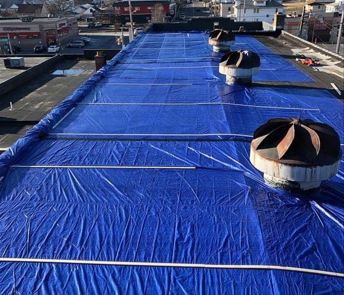 Protective tarp flat roof